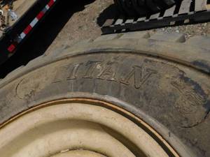 lot 40 image: 1 - Used Titan Rough Terrain Foam Filled Tire on Rim