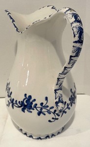 lot 132 image: White Pitcher with Cobalt Blue Floral Accents by Bassano