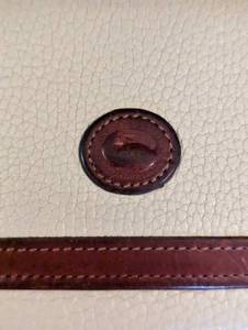 lot 433 image: Dooney and Bourke Cream Leather Wallet