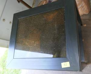 lot 82 image: Black end table with brown glass center