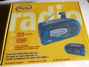 lot 124 image: New Freeplay Solar and crank Radio