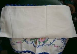 lot 212 image: Vintage embroidered pillow cases - used but very good condition, slight yellowing but no stains