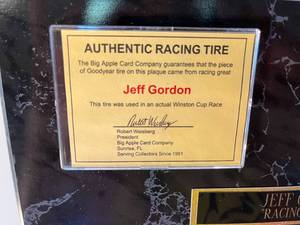 lot 14 image: Jeff Gordon plaque with genuine piece of tire from his Winston Cup race
