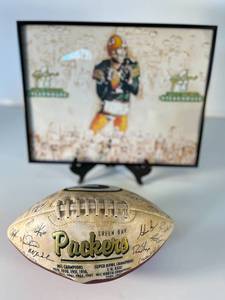 lot 24 image: ltd. edition NFL-sponsored Green Bay Packers football  Brett Favres Steakhouse framed print