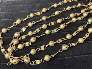 lot 82 image: very long Guatemalan wedding bead necklace - brass