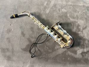 lot 88 image: silver-plate saxophone