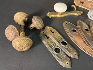 lot 128 image: lot of antique door hardware glass, porcelain, tooled brass knobs, escutcheons, key holes
