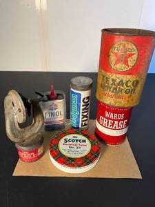 lot 135 image: retro garage necessities, mainly from the good ol days Wards Vulcanizing patch kit, 3M electrical tape, Finol household oil, Hodgman Fixing Repair kit, Texaco oil can (empty) & Wards Grease (full)