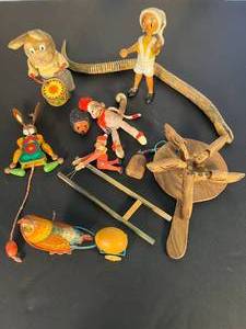 lot 139 image: lot of 10 antique toys, including a drummin bunny, wooden Pinocchio, whirligig, rollin hedgehog, sock puppet monkey, & more