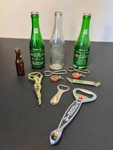 lot 146 image: crack open a bottle  2 antique 7up bottles & 1 Dr. Pepper  7 bottle openers & mini Schlitz bottle