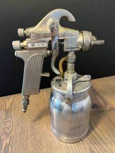 lot 204 image: car-themed tools  NAPA airbrush spray gun, Holding spray gun kit, tachdwellpoints tester, timing light, mini tire pressure gauge, remote starter switch, 