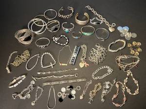lot 227 image: 42 mainly silver-colored bracelets, mostly newer and some vintage