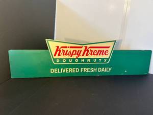 lot 198 image: Krispy Kreme Donuts sign, Woodys Surfboards sign, & oversized vintage movie posters booklet