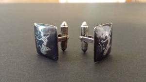 lot 244 image: pair of vintage sterling silver cuff links with topless Thai dancer engraving