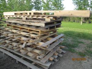 lot 7 image: Stack of large hardwood pallets for...