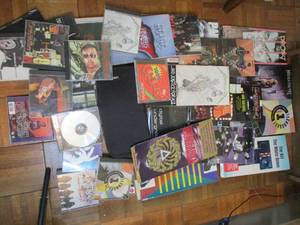 lot 307 image: Empty CD Covers with Mostly CDs in...