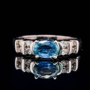 lot 33 image: Oval Natural Blue Sapphire Solitaire & Round Brilliant Cut Diamond East-West Channel Bar Ring in 14k White Gold $1,800 Retail