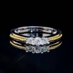 lot 34 image: Diamond Round Brilliant Cut Three-Stone Past, Present & Future Twisted Rope Ring in Two-Tone Yellow & White Gold $1,500 Retail