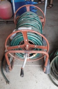 lot 144 image: Rolling Hose Reel And Hose.