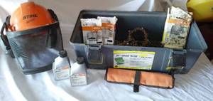 lot 205 image: Chain Saw Misc. Hard hat, bar oil, chains, and tools. .