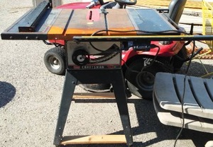 lot 54 image: Craftsman 10 in. Table Saw w Stand.
