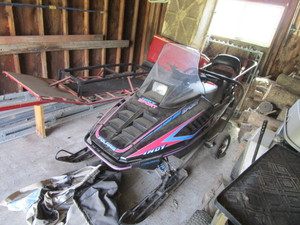 lot 14 image: 1994 Polaris Indy Sport Snowmobile & Moving Dolly