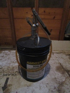 lot 58 image: 5gal Bucket Pump wApprox. 4gal 80-90 Gear Oil