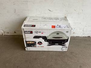 lot 110 image: Weber Q 1200 1-Burner Portable Tabletop Propane Gas Grill in Titanium with Built-In Thermometer