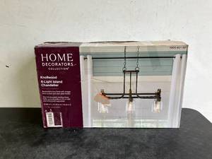 lot 115 image: Home Decorators Collection Knollwood 32 in. 6-Light Blackened Bronze Industrial Round Chandelier with Brass Accents and Clear Glass Shades