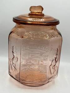 lot 16 image: Vintage 12.5 Planters Peanuts Pennant (5 Cent) 8-Sided Octagonal Jar with Lid in Pink Depression Glass