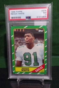 lot 190 image: 1986 Topps Reggie White #275 PSA 7 NM Rookie Card