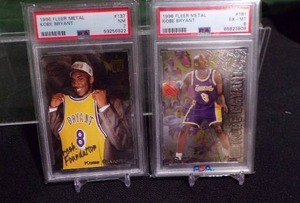 lot 199 image: 1996-97 Kobe Bryant Fleer Metal #137 PSA 7 NM & #181 PSA 6 EX-MT