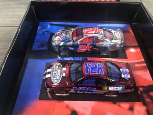 lot 56 image: 2000 Nascar Racing Champions Under the Lights Y2K & 2K 2 car set 164 scale die cast stock cars