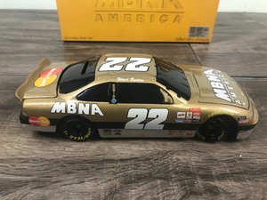 lot 67 image: 1997 Ward Burton #22 MBNA Gold Action 124 Nascar Black Window Bank Diecast