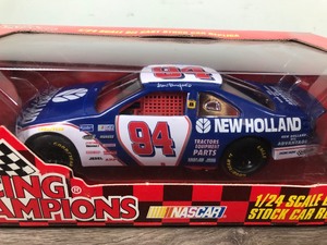lot 104 image: 1997 Nascar Racing Champions Ron Barfield Ford Taurus #94  New Holland 124 scale die cast stock car