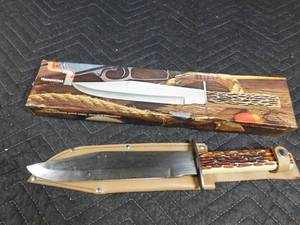 lot 260 image: Tramontina carbon steel hunting knife w sheath