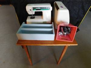 lot 389 image: Folding table,sewing machine,shelf and wheels