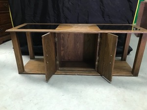 lot 9 image: Coffee table with glass inserts on top  storage underneath