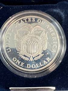 lot 63 image: 1994 PROOF US SILVER DOLLAR CAPITAL COMMEM