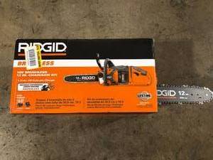lot 39 image: RIDGID 18V Brushless 12 in. Electric Battery Chainsaw with Battery and Charger     Customer Returns See Pictures