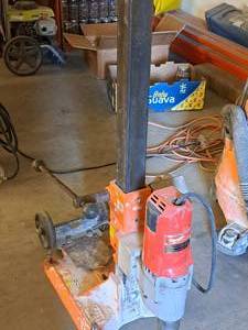 lot 56 image: Milwaukee Dymodrill 2-10 Hammer Drill with Rolling Stand