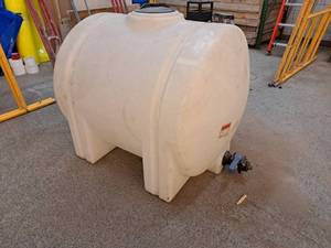 lot 35 image: 225-Gallon Plastic Tank with Valve 48x34x40