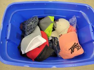 lot 56 image: Tote Full of New Baseball Caps and Winter Hats
