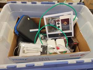 lot 62 image: Tote of Assorted Promotional Electronics - Chargers, Headphones and More