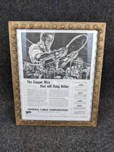 lot 545 image: WW2 era Framed General Cable Corporation Magazine ad The Copper Wire that will hang Hitler