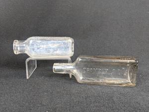 lot 575 image: Lot of (2) Vintage Glass Bottles - Hires Root Beer Extract and Chamberlains