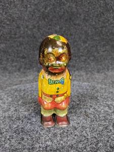 lot 508 image: Vintage African-American Tin Litho Wind-up Toy