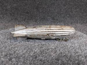 lot 498 image: 1920s AC Williams Cast Iron Graf Zeppelin Coin Bank
