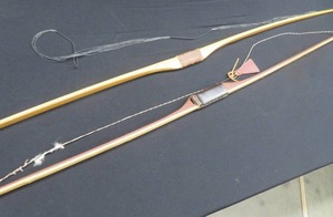 lot 34 image: 2 VINTAGE WOODEN LONGBOWS