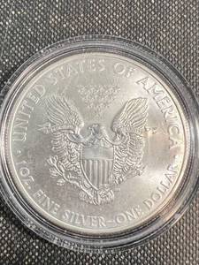 lot 64 image: 2009 AMERICAN SILVER EAGLE IN AIRTITE